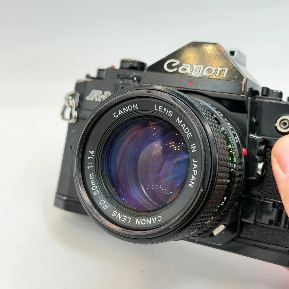 Canon A-1 35mm Film SLR Camera with FD 50mm f/1.4 Lens 1980 Olympics Cap Black